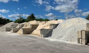 Stockpiles of sand, gravel and aggregate at a landscape supply yard